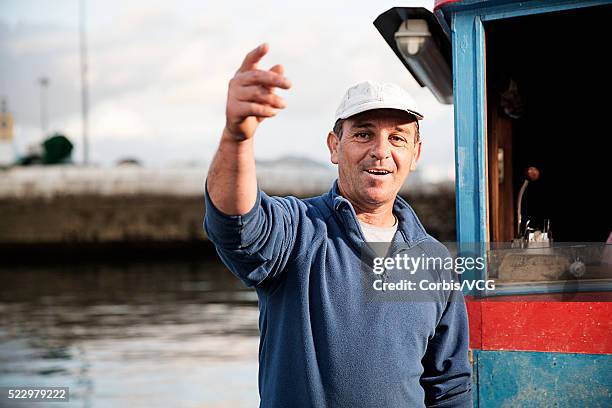 portrait of gesturing fisherman - portrait fisherman stock-fotos und bilder