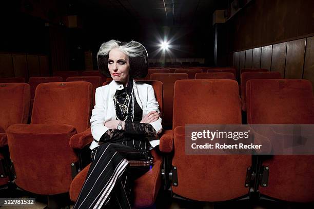 intersting looking senior woman in movie theatre - arrogance stock pictures, royalty-free photos & images