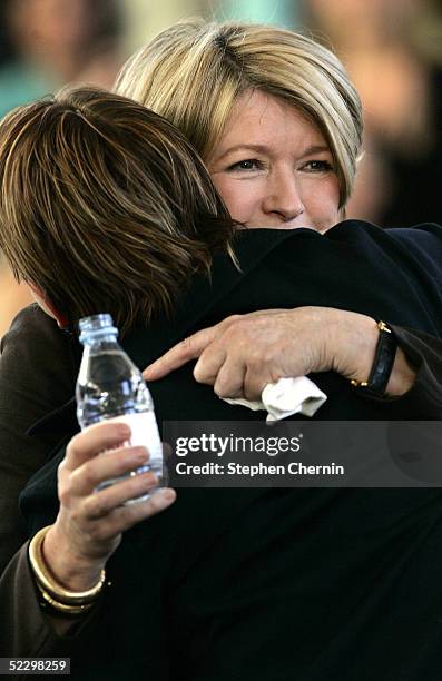 Martha Stewart hugs her daughter, Alexis, after speaking to an audience of her employees and the media on her first day back to her offices since her...