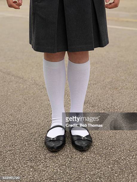 girl in school uniform - kneesock stock pictures, royalty-free photos & images