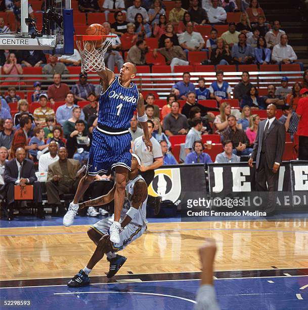 Doug Christie of the Orlando Magic dunks during the game against the New Orleans Hornets at TD Waterhouse Centre on February 15, 2005 in Orlando,...