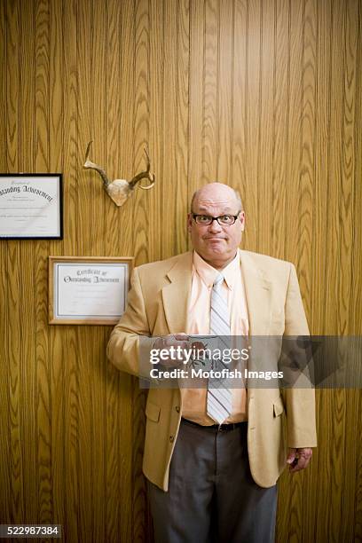 businessman making face - archival office stock pictures, royalty-free photos & images