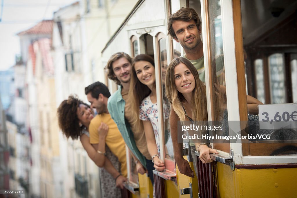 Friends on tram, Lisbon, Portugal