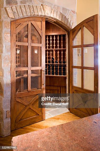 double wood and screen doors to wine cellar - wine rack stock pictures, royalty-free photos & images