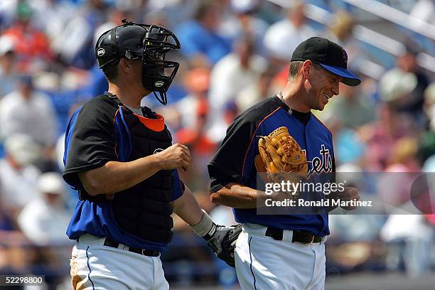 Pitcher Tom Glavine of the New York Mets with catcher Jason Phillips during MLB Spring Training against the Atlanta Braves on March 7, 2005 at...