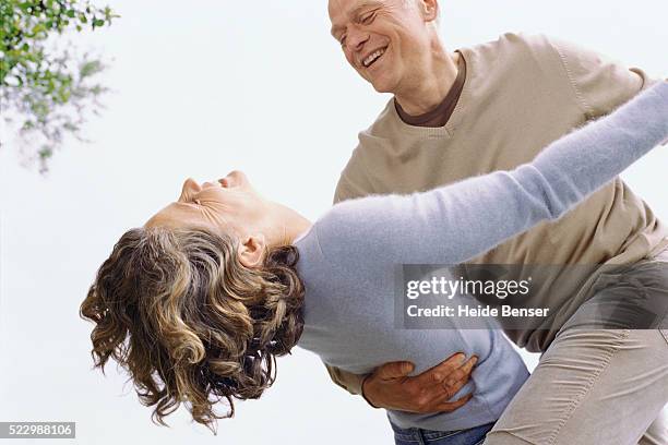 couple dancing outdoors - dipping stock pictures, royalty-free photos & images