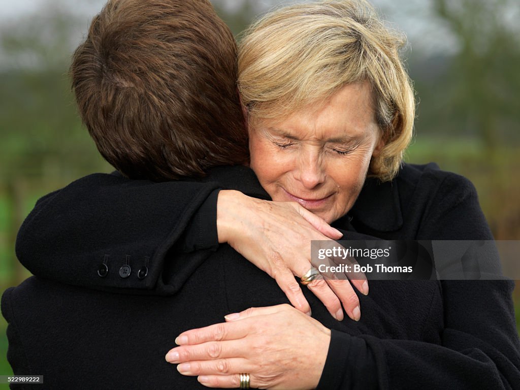 Crying Woman Hugging Man