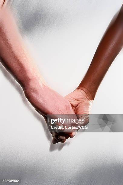 Couple Holding Hands High-Res Stock Photo - Getty Images