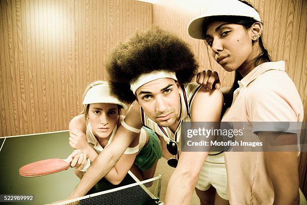 hipsters leaning table tennis table - women's table tennis stock-fotos und bilder