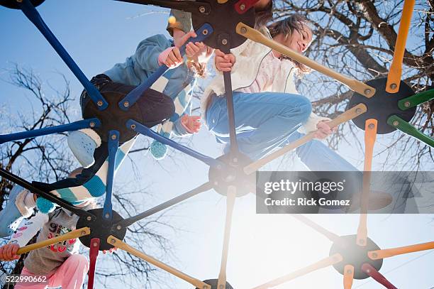 children climbing on jungle gym - jungle gym stock pictures, royalty-free photos & images