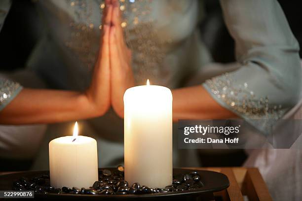 woman practices yoga in a residential meditation studio - spirituality stock-fotos und bilder