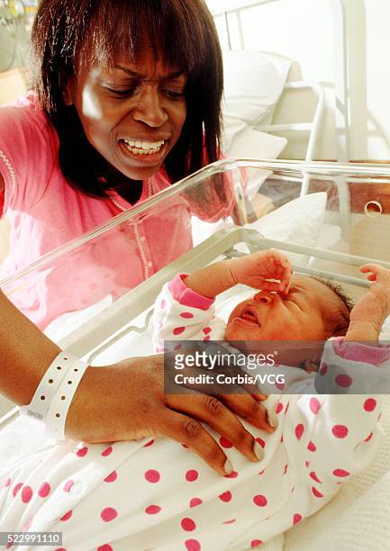 mother upset with her crying newborn - mental illness stigma stock pictures, royalty-free photos & images