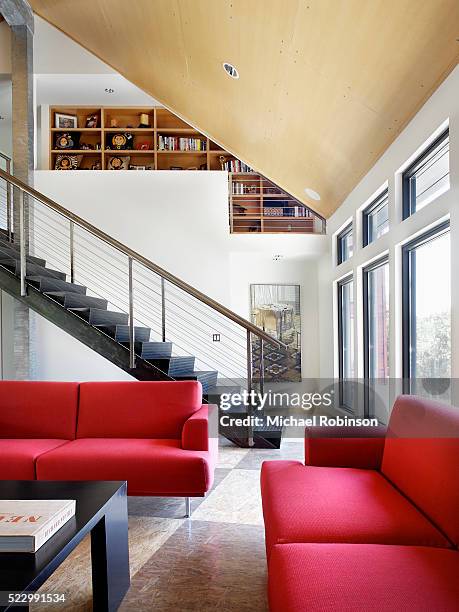 seating area by steel stairway - recessed lighting ceiling stock pictures, royalty-free photos & images