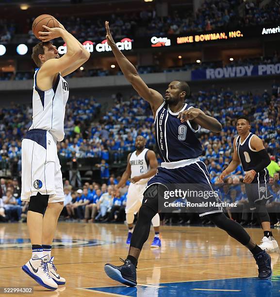 Dirk Nowitzki of the Dallas Mavericks takes a shot against Serge Ibaka of the Oklahoma City Thunder during game three of the Western Conference...