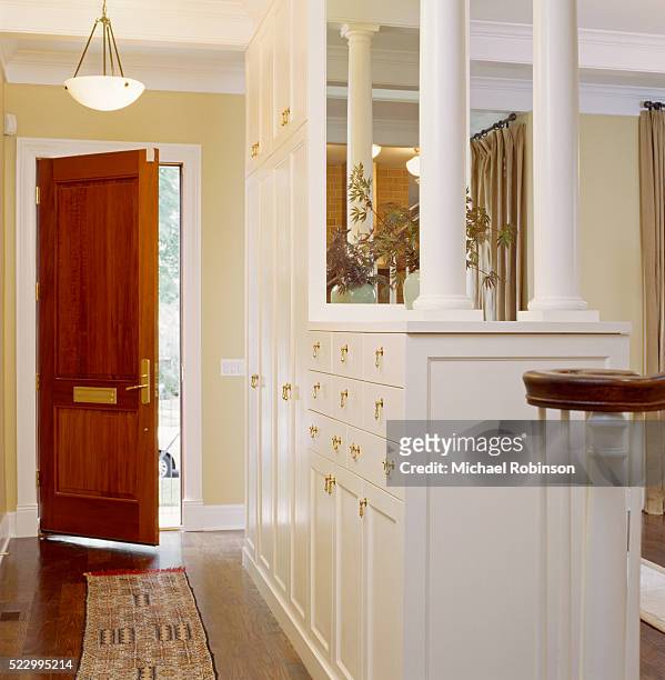built-in storage in entry hall - house entrance hall stock pictures, royalty-free photos & images