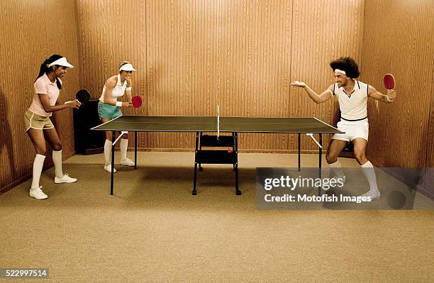 hipsters playing table tennis - funny ping pong stock-fotos und bilder