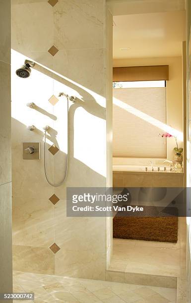 sun streaming into tiled shower stall - archive 2006 stockfoto's en -beelden