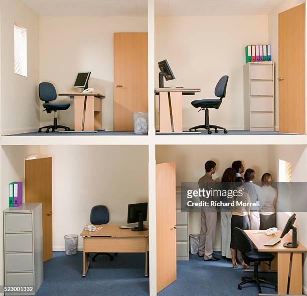 office workers crowded into corner - halb mann halb frau stock-fotos und bilder