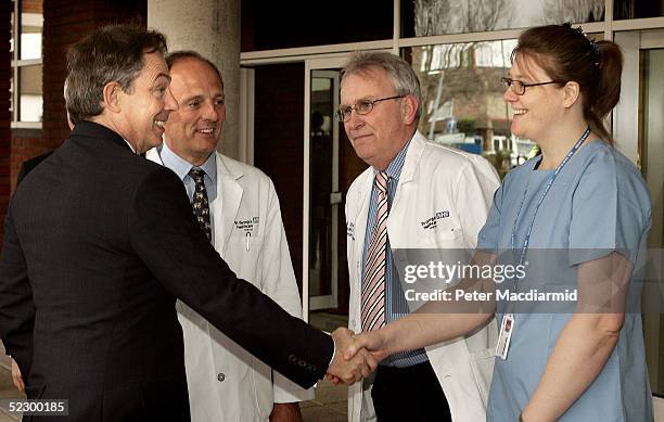 British Prime Minister Tony Blair is greeted by staff at St Georges' Hospital on March 8, 2005 in London, England. Blair announced a mini-manifesto...