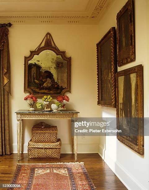 gold framed paintings and antique table in corner - archive 2006 stock pictures, royalty-free photos & images