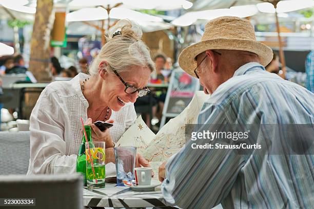 couple seated in outdoor restaurant - guy carcassonne stock pictures, royalty-free photos & images