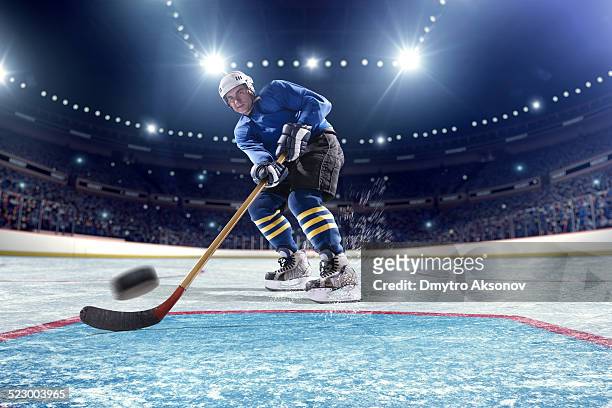 ice hockey player scoring - hockey stock pictures, royalty-free photos & images