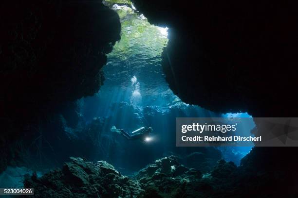 scuba diving in mbuco caves, solomon islands - spelunking stockfoto's en -beelden