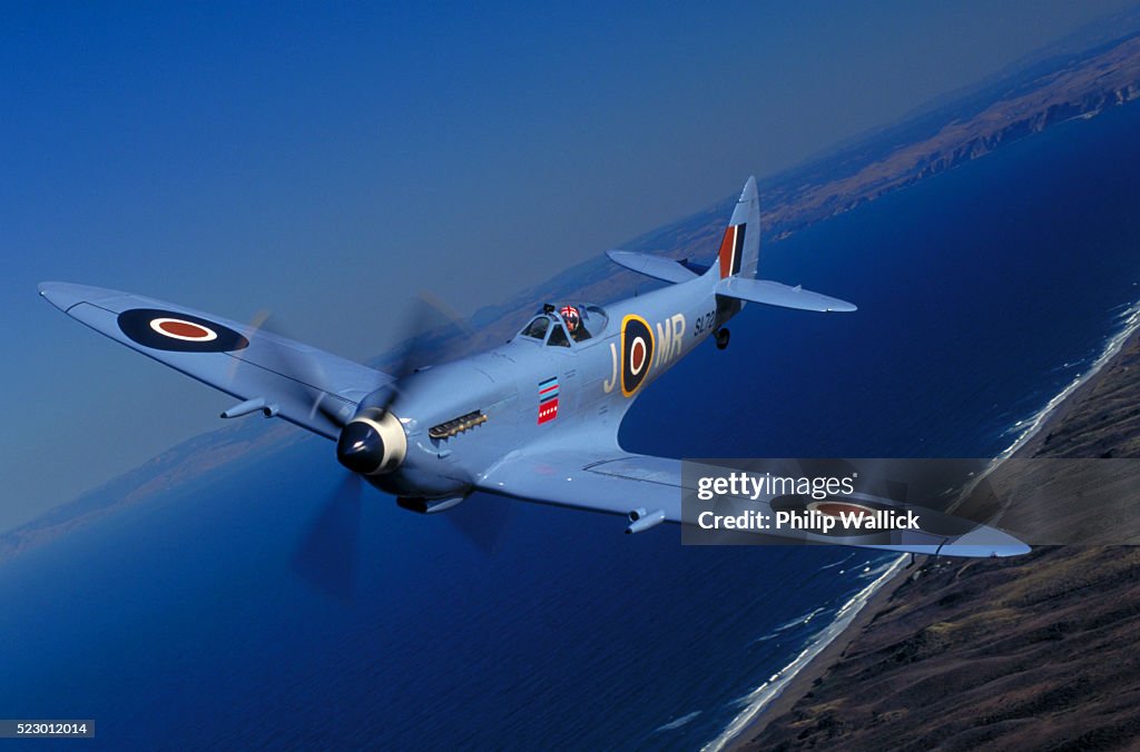 Blue British Spitfire fighter plane