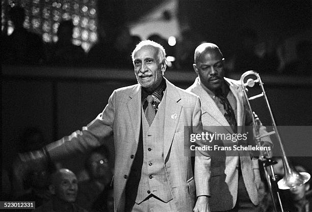 Cuban piano player Ruben Gonzalez enters the stage with trombone player Juan de Marcos at the BIM huis on September 28th 1997 in Amsterdam, the...
