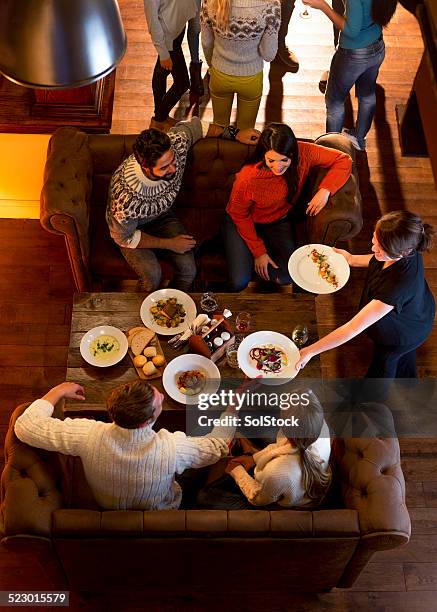 group of friends having a meal - gastro pub stock pictures, royalty-free photos & images