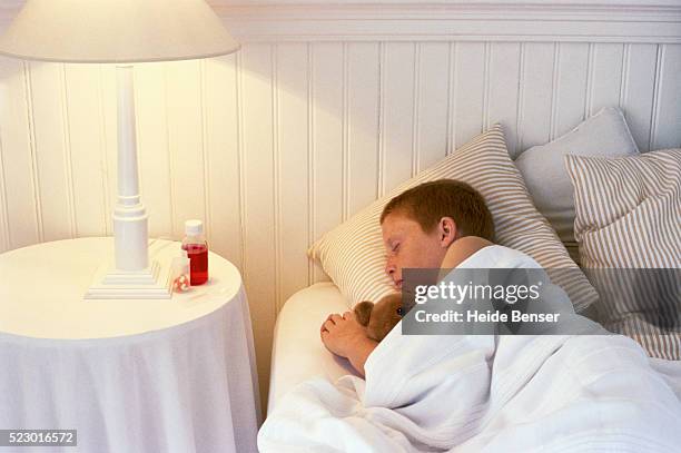 sleeping boy - bedside table kid asleep stock pictures, royalty-free photos & images