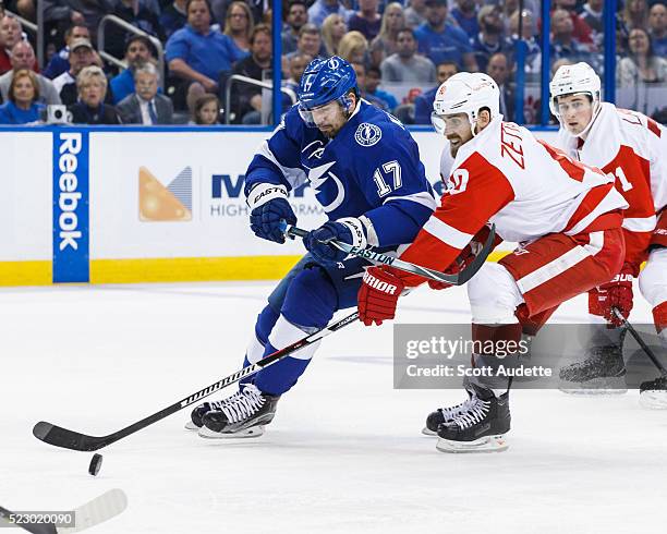 Alex Killorn of the Tampa Bay Lightning battles for the puck against Henrik Zetterberg of the Detroit Red Wings during the third period of Game Five...