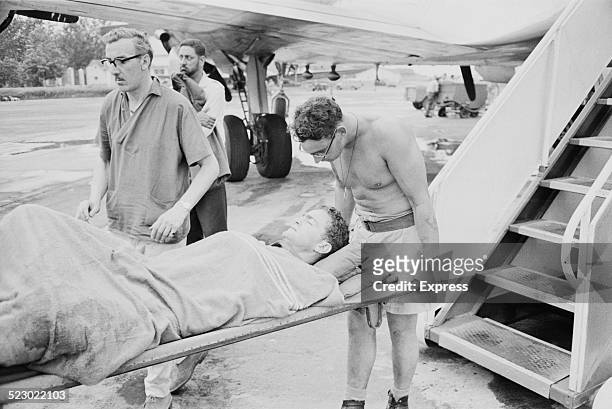 South African mercenary is wounded in Stanleyville during the Congo Crisis, 1964.