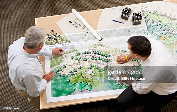 two design professionals at work in an office - landscaped stock pictures, royalty-free photos & images