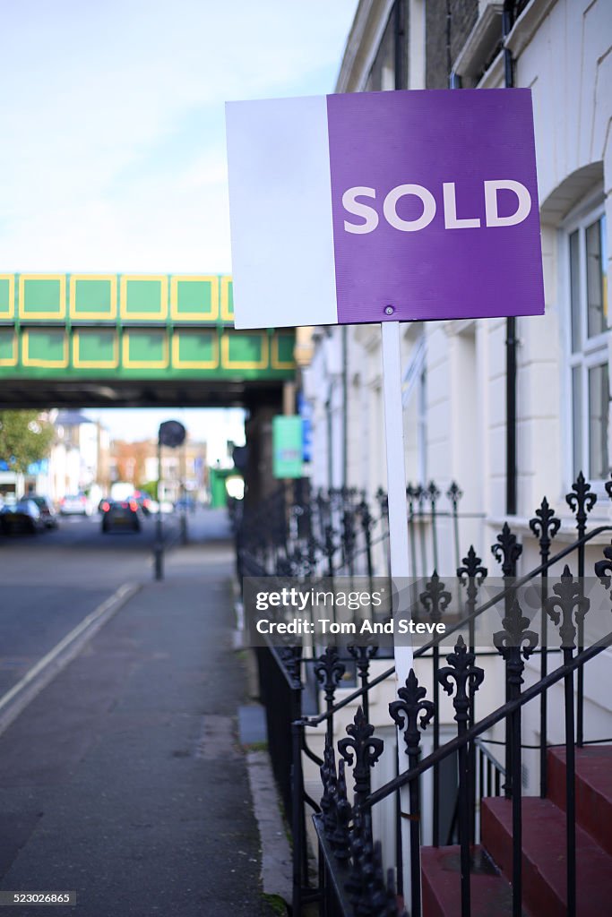 House sign with 'Sold' written on it