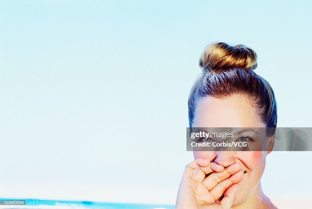 Smiling Woman with Hair Bun