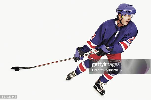 skating away with the puck - hockey puck white background stock pictures, royalty-free photos & images