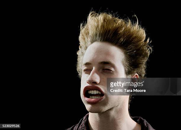 man with face being blown by powerful wind - vento foto e immagini stock