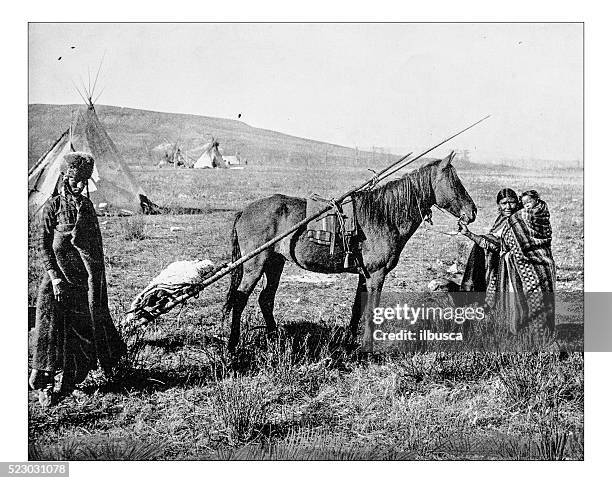 antique photograph of 19th century native american family - savannah stock illustrations