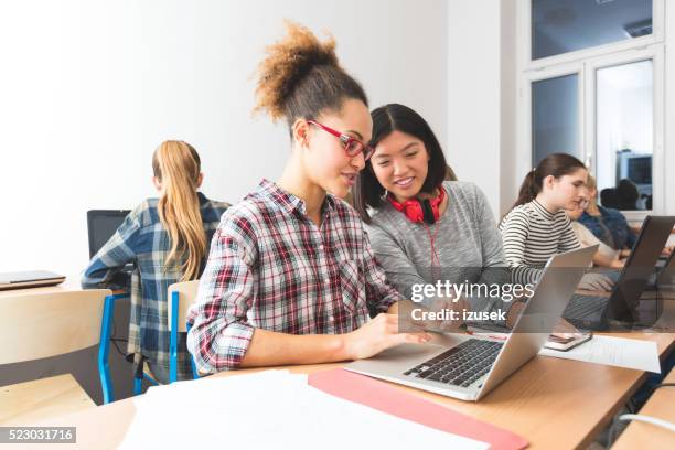 multi ethnic students learning computer programming, working together - learning skill stock pictures, royalty-free photos & images