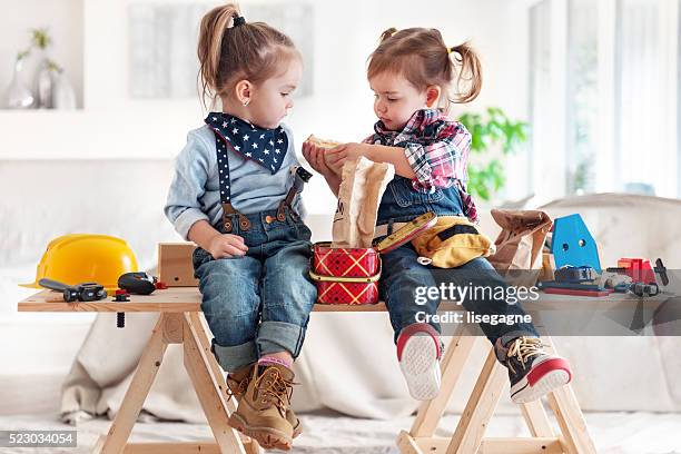 two little girls sharing lunch - lunch bag stock pictures, royalty-free photos & images