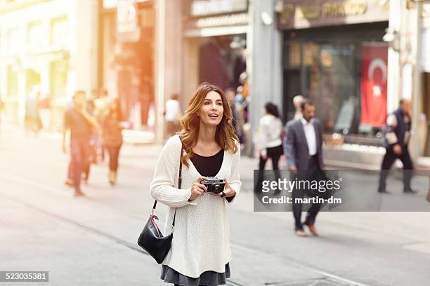 woman sightseeing in istanbul - walking toward camera stock pictures, royalty-free photos & images