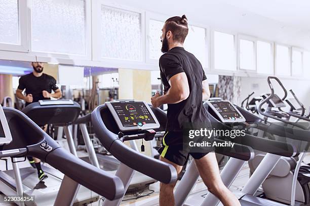 jogging on treadmill. - athlete bulges stock pictures, royalty-free photos & images