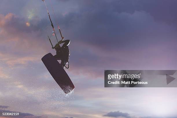 night rider kite surf - kite surfing stock pictures, royalty-free photos & images