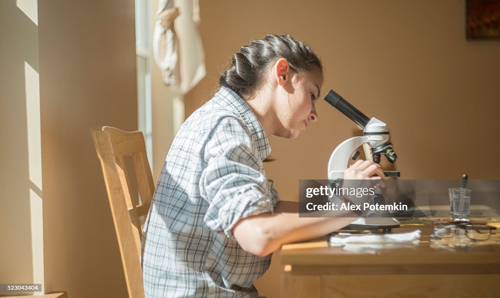 Microscope Image Homework Teenage Girl Make Homework Scientific Project With Microscope High-Res ...