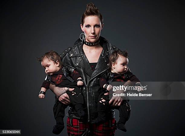 mother with twins - punk rocker stockfoto's en -beelden