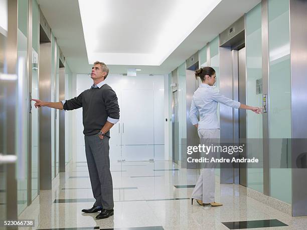 people waiting for elevator - elevetor photo stock pictures, royalty-free photos & images
