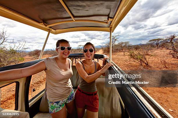 two girls, about 13 and 18 years, in a safari bus, samburu national reserve, kenya, east africa, publicground - 18 19 years photos foto e immagini stock