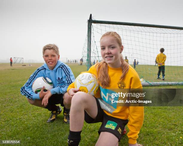 teens playing football aka soccer, iceland - akranes bildbanksfoton och bilder