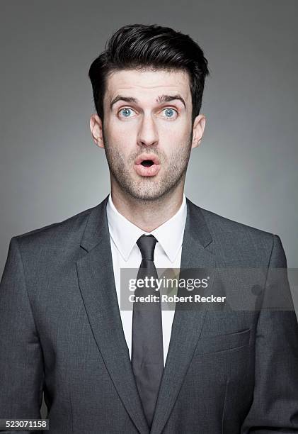 studio portrait of surprised business man - ties imagens e fotografias de stock